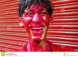 Close up of a boy&#39;s face smeared with red colour during the Holi festival in India. MR: YES; PR: NO - boy%25C3%25A2%25E2%2582%25AC%25E2%2584%25A2s-face-smeared-colour-8298866