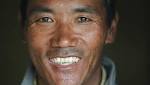 Sherpa guides scales Everest setting