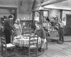 All in the Family 1971 TV series cast Carroll O'Connor as Archie Bunker Jean Stapleton as Edith Rob Reiner Sally Struthers 1970s CBS television stills living room chair, AI generated