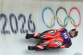 Luge team in blue