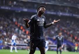 Vinicius double delays Barca title as Real Madrid down Espanyol
