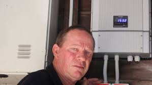 POWER OF: Nigel Carrall of Annerley had to replace his Sharp solar power inverter after the original part was faulty. Picture: Liam Kidston. - 448644-nigel-carrall