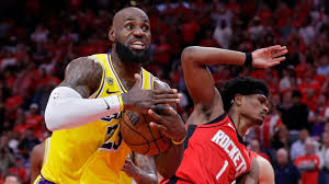 LeBron James scores 29 points and makes three-pointer with 13 seconds left as Los Angeles Lakers storm back late to go 3-0 against Houston Rockets
