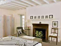 Image result for Cottage Guest Bedroom with Exposed beam & Carpet