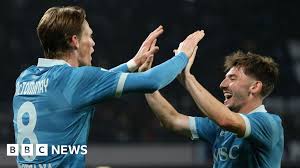 Scott McTominay celebrates with fans in Naples