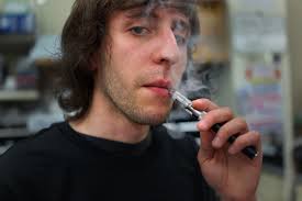 <b>John Urban</b> smokes an electronic cigarette at Vape New York an. - 170298239-john-urban-smokes-an-electronic-cigarette-at-gettyimages