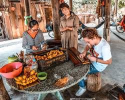 Image of Local vendors selling snacks and drinks near Battambang Bat Cave