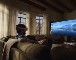 Image of Apple Vision Pro user watching a movie in an immersive environment