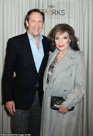 Dame Joan Collins, 92, enjoys a night out with husband Percy Gibson, 61, at M&S loyalty launch