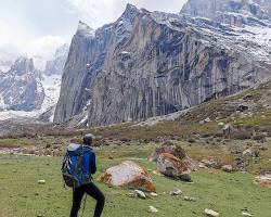 Image of Hiker on mountain ridge in Pakistan's Karakoram mountains