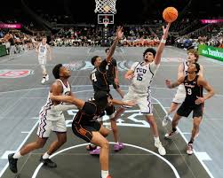 Big 12 abandons conference tournament's glass LED court after Texas Tech star's injury, goes back to hardwood