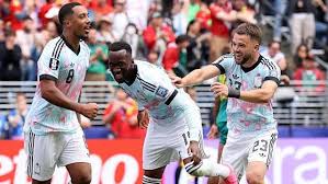 Raskin helps Belgium stage comeback to book last-16 place