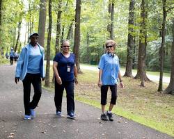 group of people walking in a park