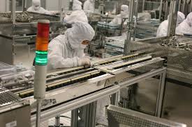 Clean Room Workers In Seagates Electronics Manufacturing Facility