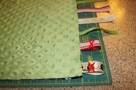 Résultat de recherche d'images pour "taggy blanket"