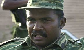 Colonel Karuna Amman, the Tamil paramilitary leader who was jailed for entering Britain on a fraudulent passport and investigated by the Metropolitan police ... - muralitharan460