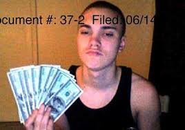 One of the computers belonging to Arthur Williams III contained photos of him posing with his finished counterfeit bills, according to federal authorities. - ArthurWilliams