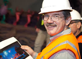 Mark Henn holds one of the Imagineer&#39;s early renderings of the attraction. - 050311_3