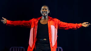 Usher brings out Big Sean, turns Little Caesars Arena into roller rink at 
hits-filled show