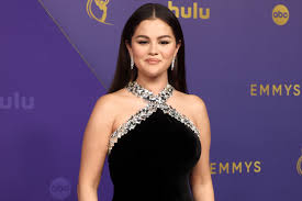 Selena Gomez Is a Shining Star in Bejeweled Halter Gown and Eye-Catching 
Bling at 2024 Emmys