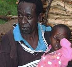 Maurice Otieno, pictured here with his son Peter, is a subsistence farmer in the lush, garden-like setting of Kit-Mikaye village in rural Kisumu. - b8fa2183115b429aa774611c493ee84d