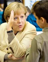 Pool photo by Michael Huebner. Angela Merkel of Germany, who visited a Berlin school Thursday, will meet with Nicolas Sarkozy of France on Saturday. - Bailout-articleInline