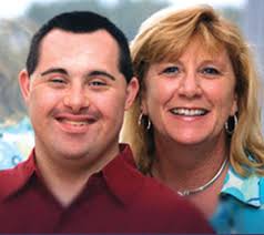 BETSY FARMER, above with her son Luke, filled a critical need when she created the award-winning Space Coast Early Intervention Center. - betsy-luke-300-4