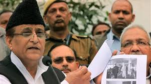 Uttar Pradesh minister Mohd Azam Khan showing pictures of his foreign visit at his residence in Lucknow. (PTI) - azamkhanm