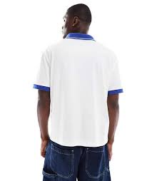 ASOS DESIGN boxy relaxed polo with city graphic and paneling in white and blue | ASOS