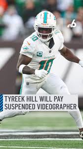 Miami Dolphins wide receiver Tyreek Hill said he will cover the pay for an NFL photographer who was suspended after celebrating with him after a touchdown earlier this season. Kevin Fitzgibbons, who had been contracted by the NFL to shoot Dolphins home games, was behind the endzone when Hill scored a 41-yard touchdown in the second quarter against the Carolina Panthers. Hill took a phone from Fitzgibbons and filmed himself doing a backflip before handing the phone back. The NFL’s UK Twitter account posted the video before promptly deleting it. 📲 Tap the link in our bio for more #nfl #miamidolphins #tyreekhill