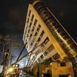 Rescuers scour tilting buildings after
