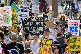 'ICE Out' protesters swarm downtown LA calling for immigration raids to end