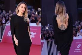 Angelina Jolie Flaunts Back Tattoos at Couture Premiere
