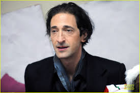 About this photo set: Adrien Brody holds onto a book while attending The Action Center&#39;s Post-Sandy Holiday Party held at The Action Center on Friday ... - adrien-brody-action-center-post-sandy-holiday-party-16