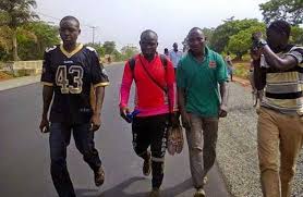Image result for Man trekking for Jonathan in solidarity