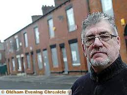 Peter Hibberd outside the “tinned-up” houses in Derker - 20081230_113855