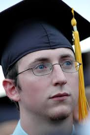 Angela Abbamonte, Digital media studies graduate Casey Yates listens as President Dockery gives closing remarks during spring graduation - 11274-45