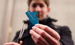 Move Your Money campaign targets Barclays bank. A Barclays customer cuts up his card during a protest outside a branch in central London as part of the ... - Move-Your-Money-campaign--006