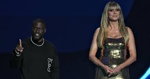 How tall is Kevin Hart as Heidi Klum towers over him at World Cup draw