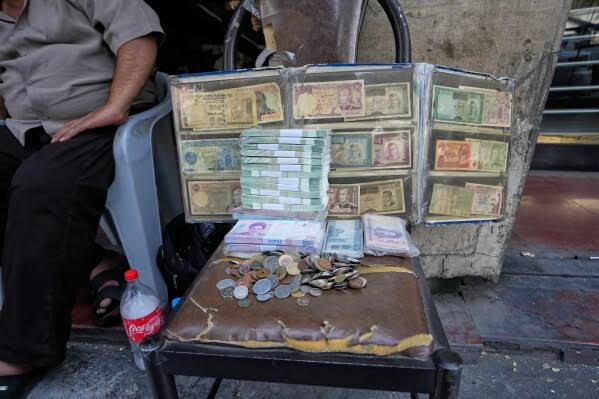 Iran's rial hits record low as US prepares to announce new sanctions; currency drops to 2.02 million per dollar amid war