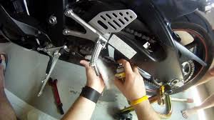 Image result for spray lubricants at motorbike chain