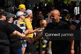 Interim head coach Laurent Courtois greets fans as he arrives to the stadium before the game against FC Cincinnati at