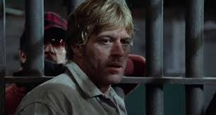 The movie is about Henry Brubaker (Robert Redford), the new warden of a prison in Arkansas who initially poses as an inmate to try to figure out just how ... - brubaker-redford-inmate