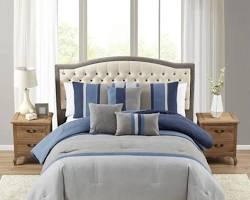 Image of bedroom with soft bedding and throw pillows