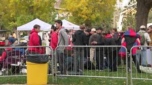 College GameDay stage set up on a university campus with fans in background