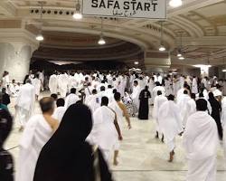 صورة person praying between Safa and Marwah during Umrah