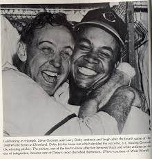 (photo 56) This is Larry Doby shortly after he signed with the Indians. (photo 55) This is Doby in 1948 being embraced by pitcher Steve Gromek after Doby&#39;s ... - 55