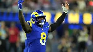 Jared Verse receives guidance from Aaron Donald