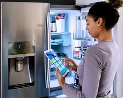 Изображение: smart refrigerator screen with notifications about expiring food items