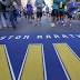 People gather at the Boston Marathon finish line on Saturday ...